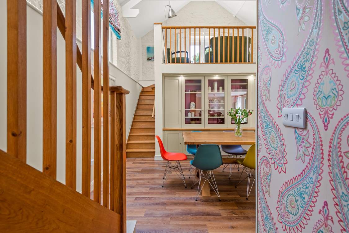 Up the wooden stairs, you have the luxury of a snug, which also leads out onto the decked patio-area.