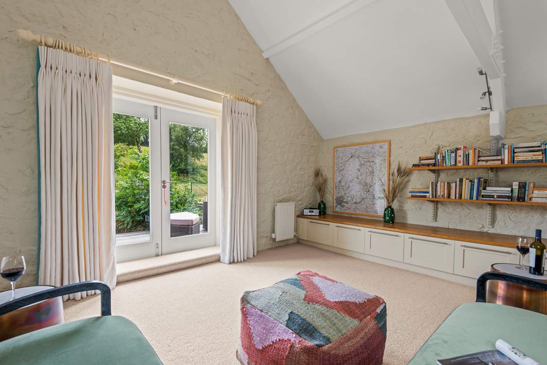 The mezzanine snug opens up onto the decked area.
