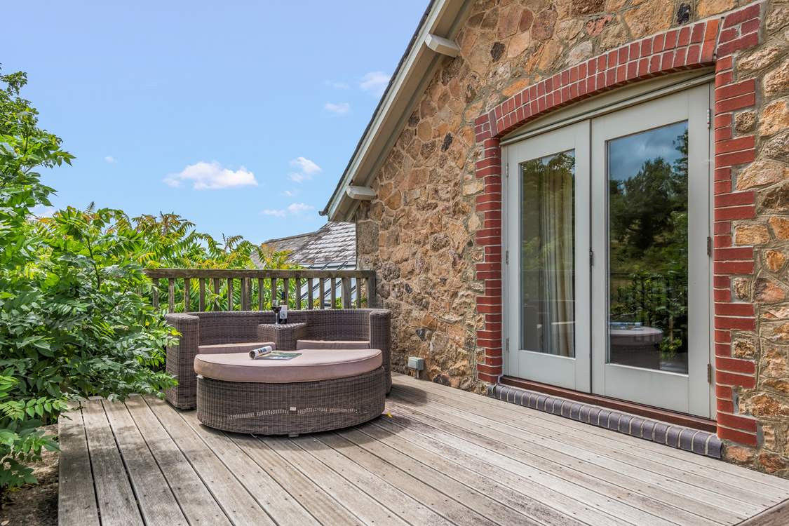 Your private and tranquil decked area is the perfect place to soak up some Devon sun.