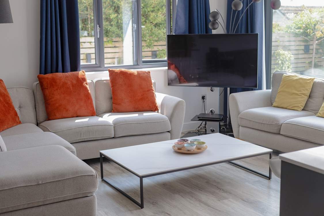Sit back, unwind and enjoy the Smart TV from the comfort of the sofa.