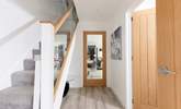 The entrance hall leading into the open plan living space. There is a utility-room on your left and a handy downstairs cloakroom. - Thumbnail Image