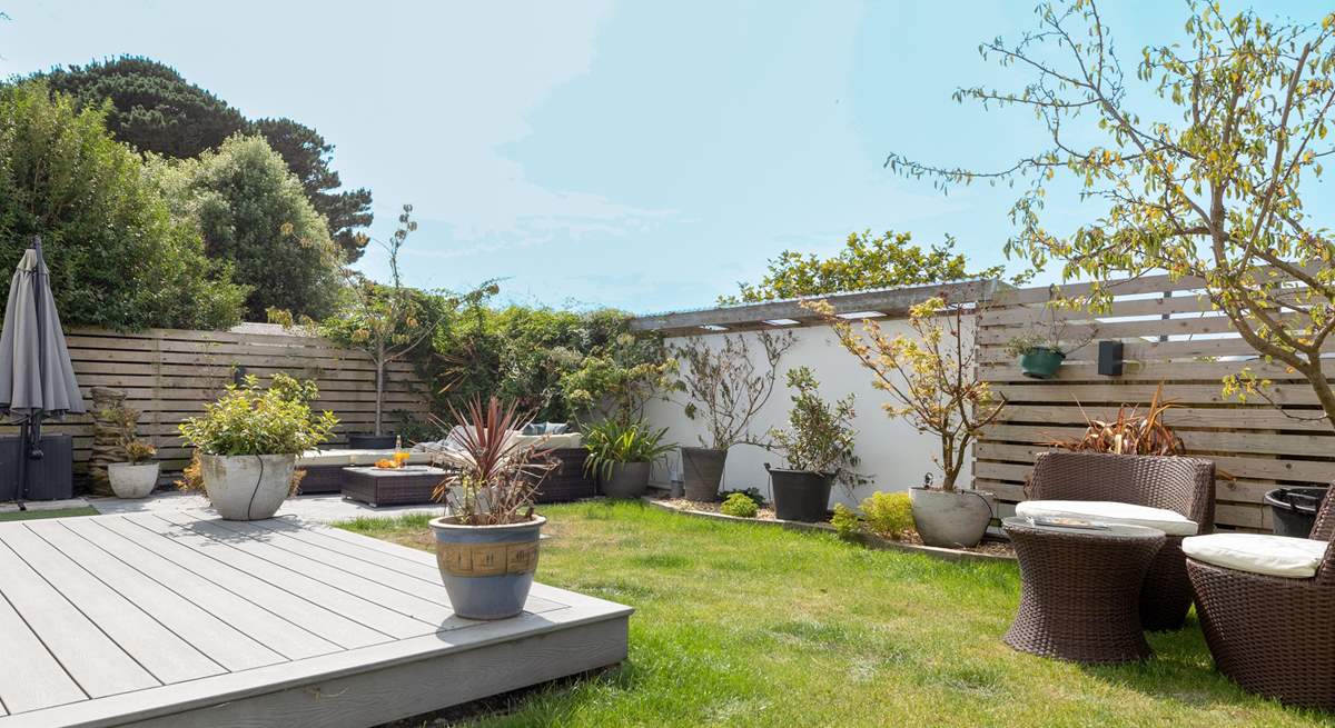 Outdoor living made easy, comfortable rattan seating and the beach on your doorstep.