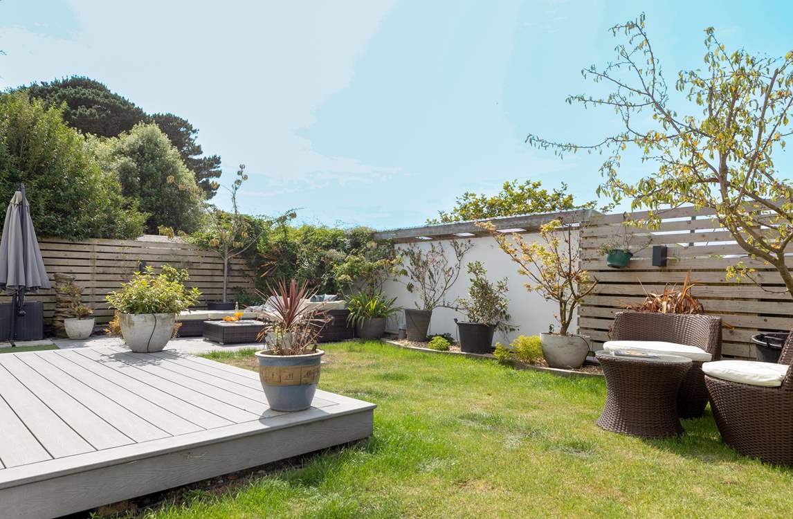 Outdoor living made easy, comfortable rattan seating and the beach on your doorstep.