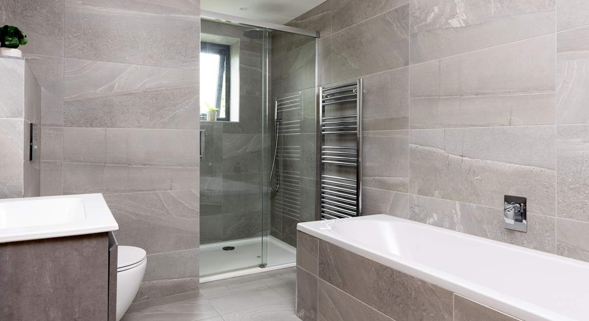 The stylish tiled family bathroom on the first floor with both a bath and separate power shower.