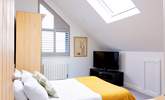 Bedroom 4 has a double bed and views of Praa Sands below. - Thumbnail Image