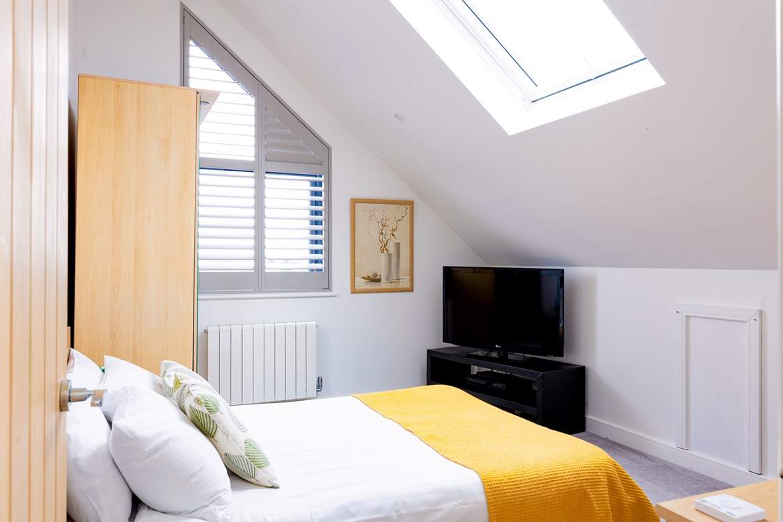 Bedroom 4 has a double bed and views of Praa Sands below.