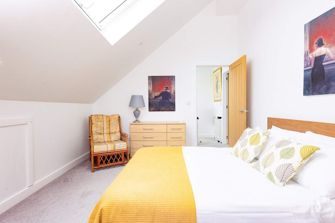 Bedroom 4 is filled with light and has distant sea views.