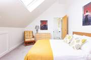 Bedroom 4 is filled with light and has distant sea views.