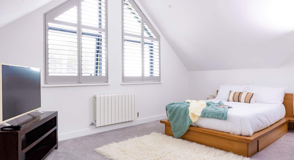 Bedroom 3 is a huge bedroom with a private en suite shower-room, scenic sea views and a Smart TV.