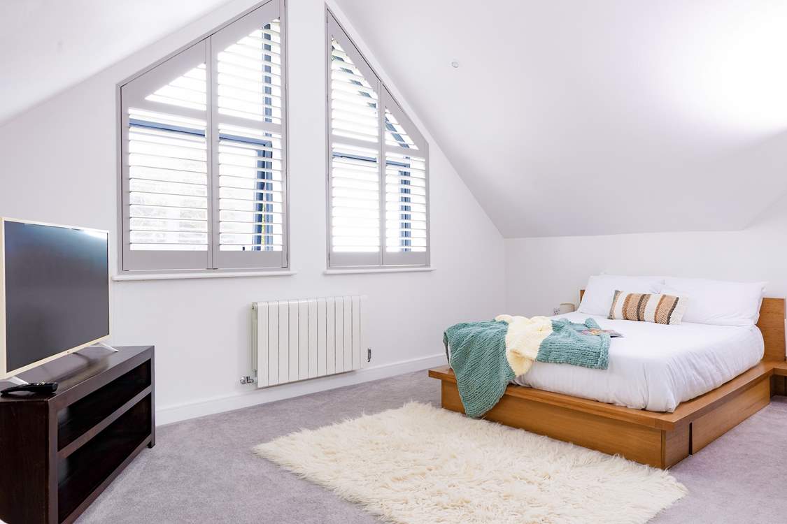 Bedroom 3 is a huge bedroom with a private en suite shower-room, scenic sea views and a Smart TV.