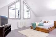 Bedroom 3 is a huge bedroom with a private en suite shower-room, scenic sea views and a Smart TV.