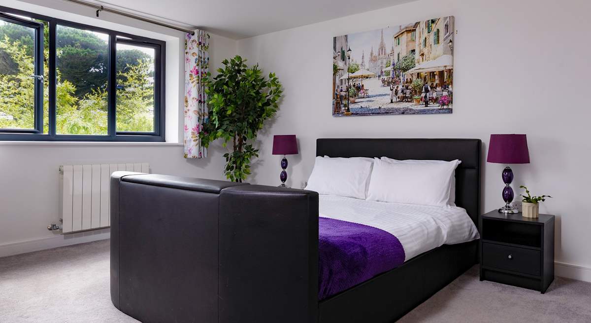 Bedroom 2 has a king-size bed with a Smart TV.