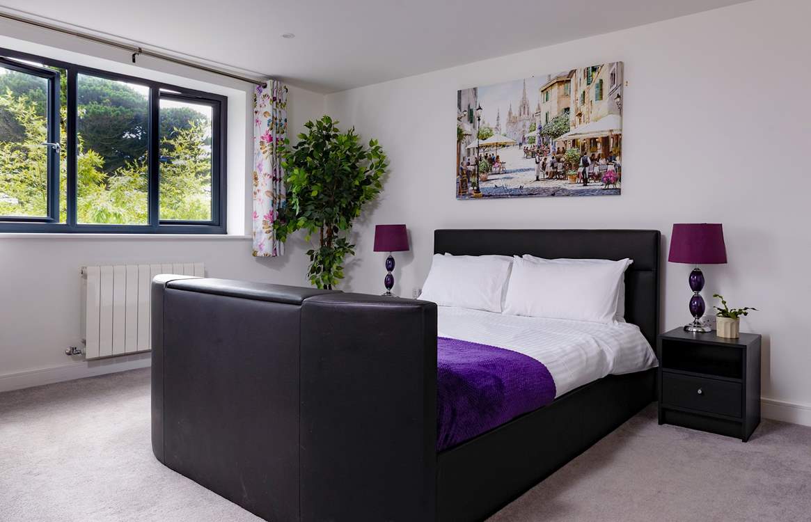 Bedroom 2 has a king-size bed with a Smart TV.