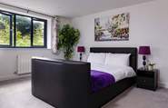 Bedroom 2 has a king-size bed with a Smart TV.