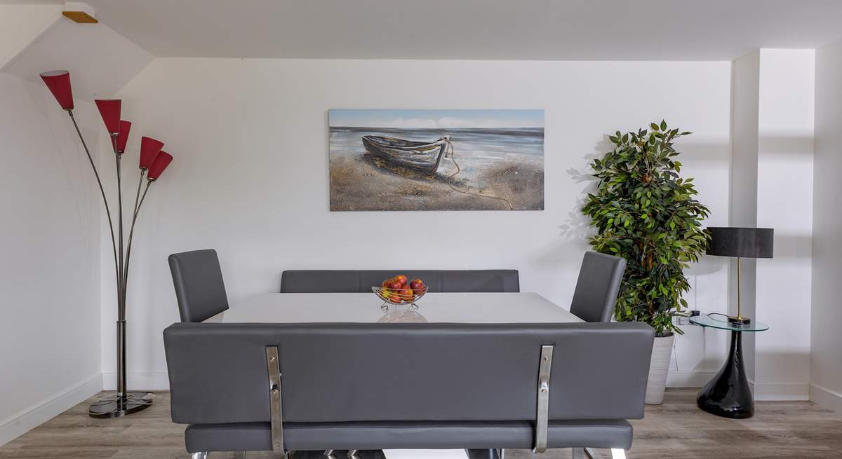 A spacious dining-table for entertaining eight guests.