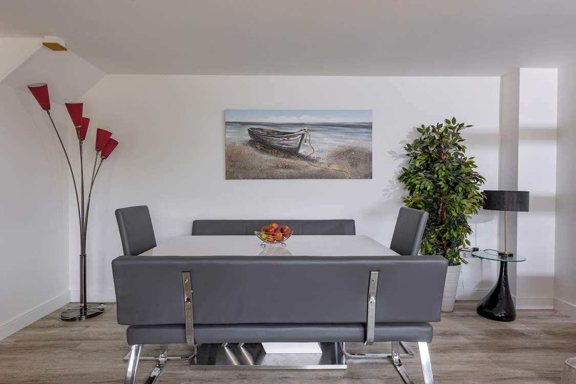 A spacious dining-table for entertaining eight guests.