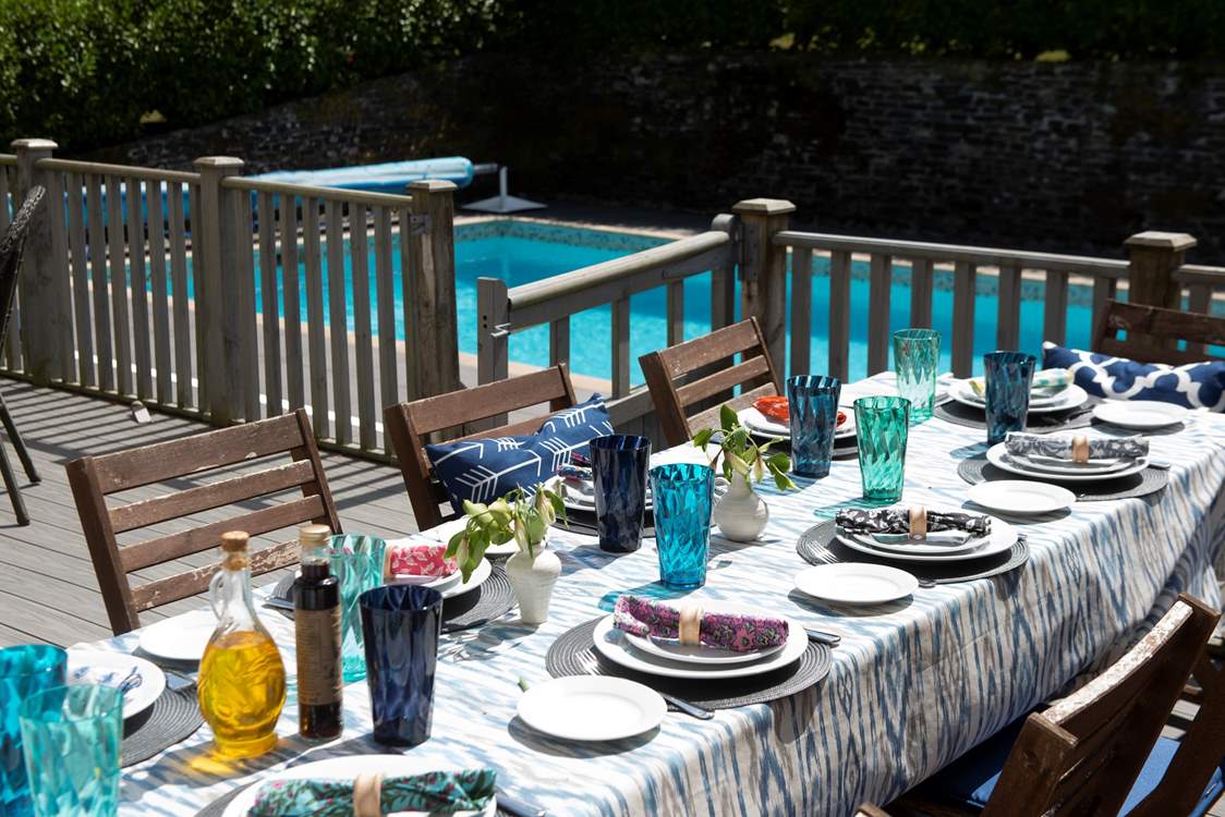 The poolside terrace is designed for long midsummer days.