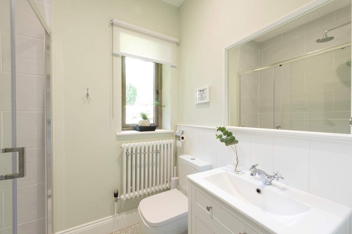 The en suite to bedroom 4 has a spacious shower.