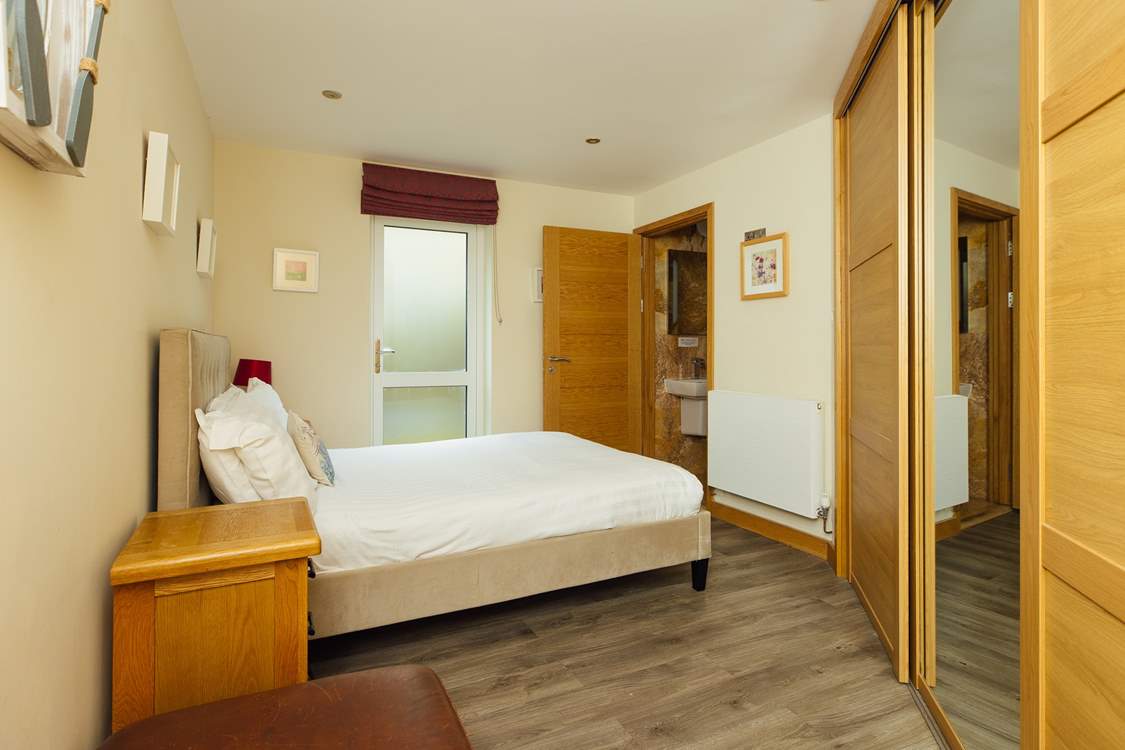 Ground floor double en suite room with garden access.