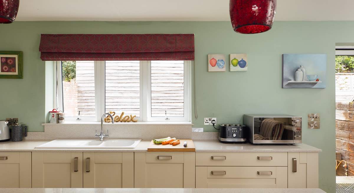 Gorgeous kitchen with views over the garden. Adjacent utility-room. 
