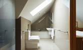 Exquisite bathroom with rainfall option shower and bath tub. Doors leading to the principal and twin bedrooms.  - Thumbnail Image