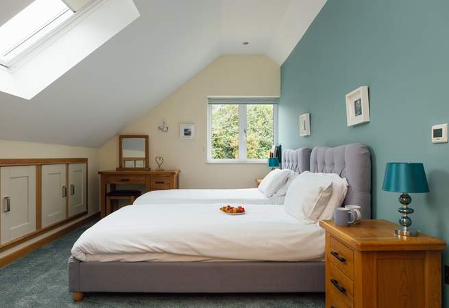 Sweet twin room with doors to the adjacent bathroom, shared with the principal bedroom on the third floor. (On request the twin beds can be made up as a king bed). 