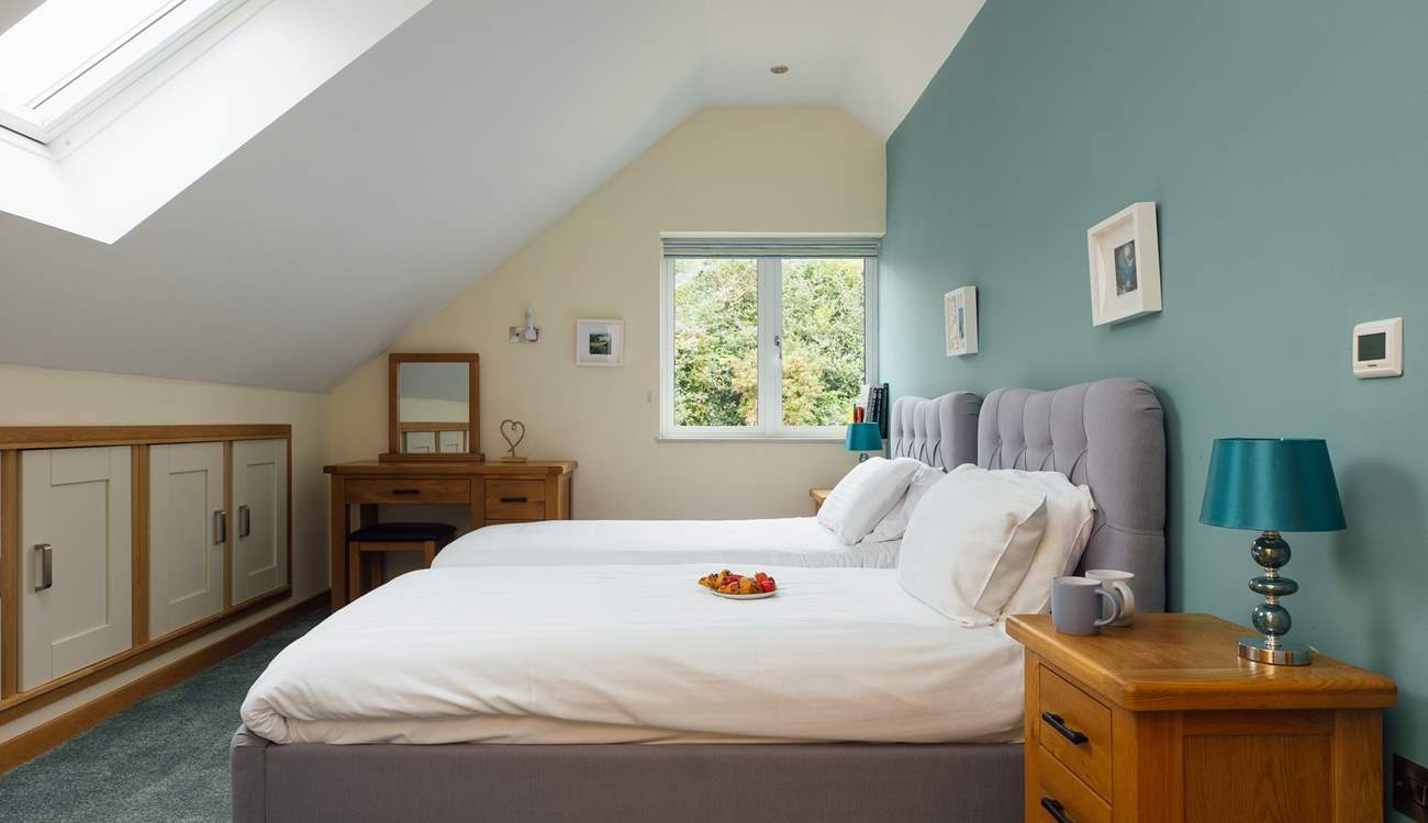 Sweet twin room with doors to the adjacent bathroom, shared with the principal bedroom on the third floor. (On request the twin beds can be made up as a king bed). 