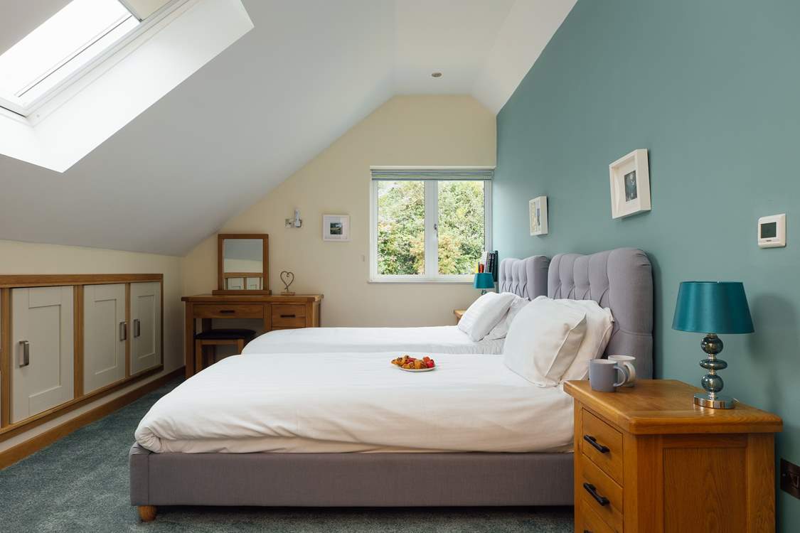 Sweet twin room with doors to the adjacent bathroom, shared with the principal bedroom on the third floor. (On request the twin beds can be made up as a king bed).