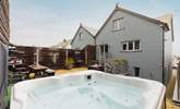 Perfect at anytime of the day, relax in the heavenly hot tub.  - Thumbnail Image
