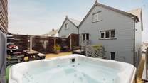 Perfect at anytime of the day, relax in the heavenly hot tub. 