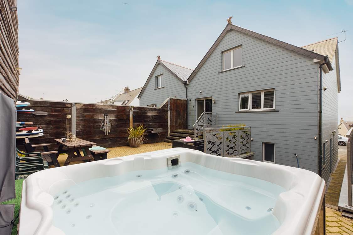 Perfect at anytime of the day, relax in the heavenly hot tub.