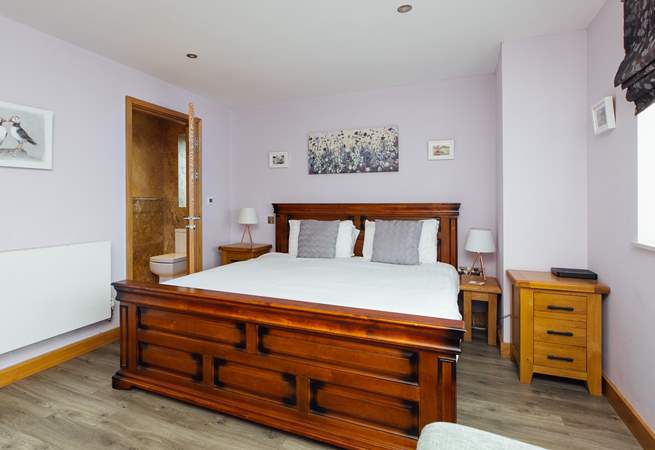 With a view to the front, the gorgeous super-king en suite on the ground floor. 