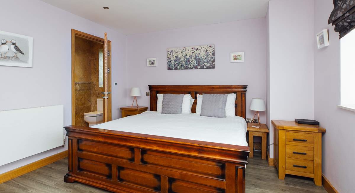 With a view to the front, the gorgeous super-king en suite on the ground floor. 