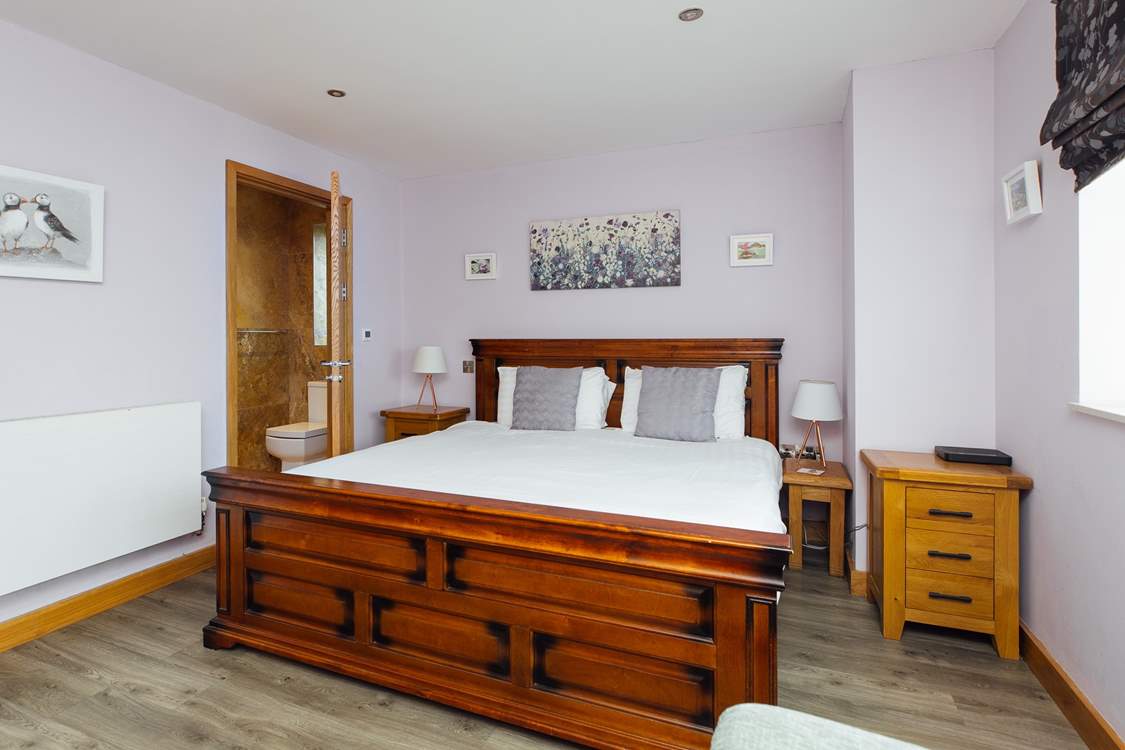 With a view to the front, the gorgeous super-king en suite on the ground floor.