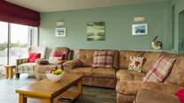 Big, comfy sofa, ideal for relaxing after a fun day exploring the Pembrokeshire coast. 