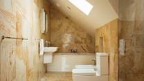 Luxurious second floor bathroom with separate walk-in shower.