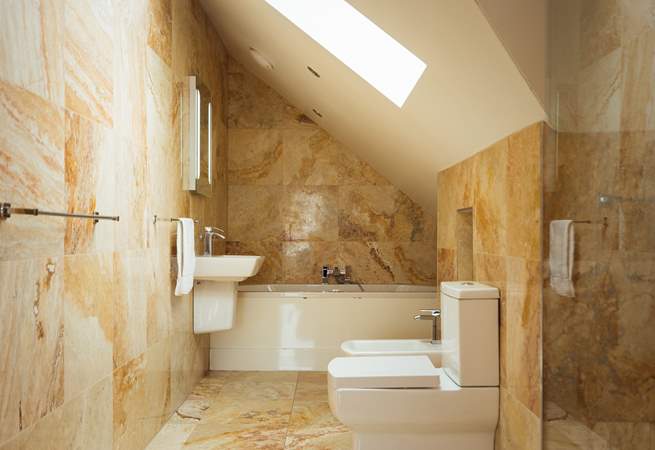 Luxurious second floor bathroom with separate walk-in shower.