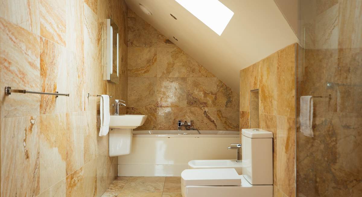 Luxurious second floor bathroom with separate walk-in shower.
