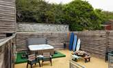 A sunny spot to relax in with luxurious hot tub. Perfect after a beach day.  - Thumbnail Image