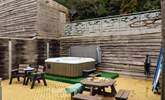 Relax in the luxurious hot tub after a day exploring the magnificent coast.  - Thumbnail Image