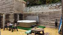 Relax in the luxurious hot tub after a day exploring the magnificent coast. 