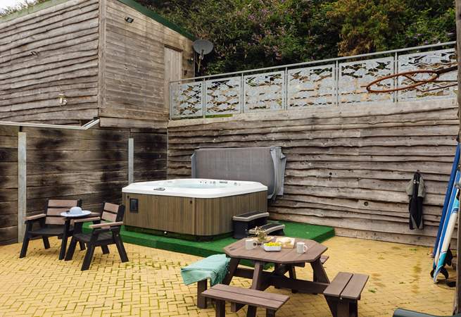 Relax in the luxurious hot tub after a day exploring the magnificent coast. 