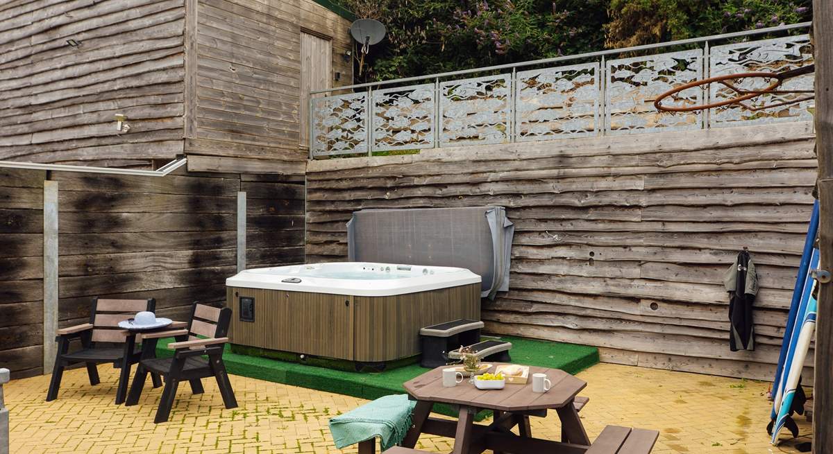 Relax in the luxurious hot tub after a day exploring the magnificent coast. 