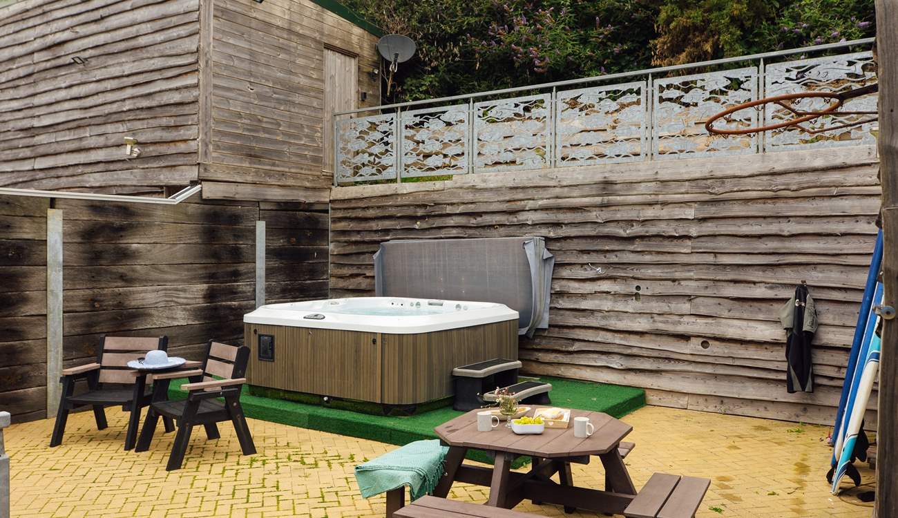 Relax in the luxurious hot tub after a day exploring the magnificent coast. 