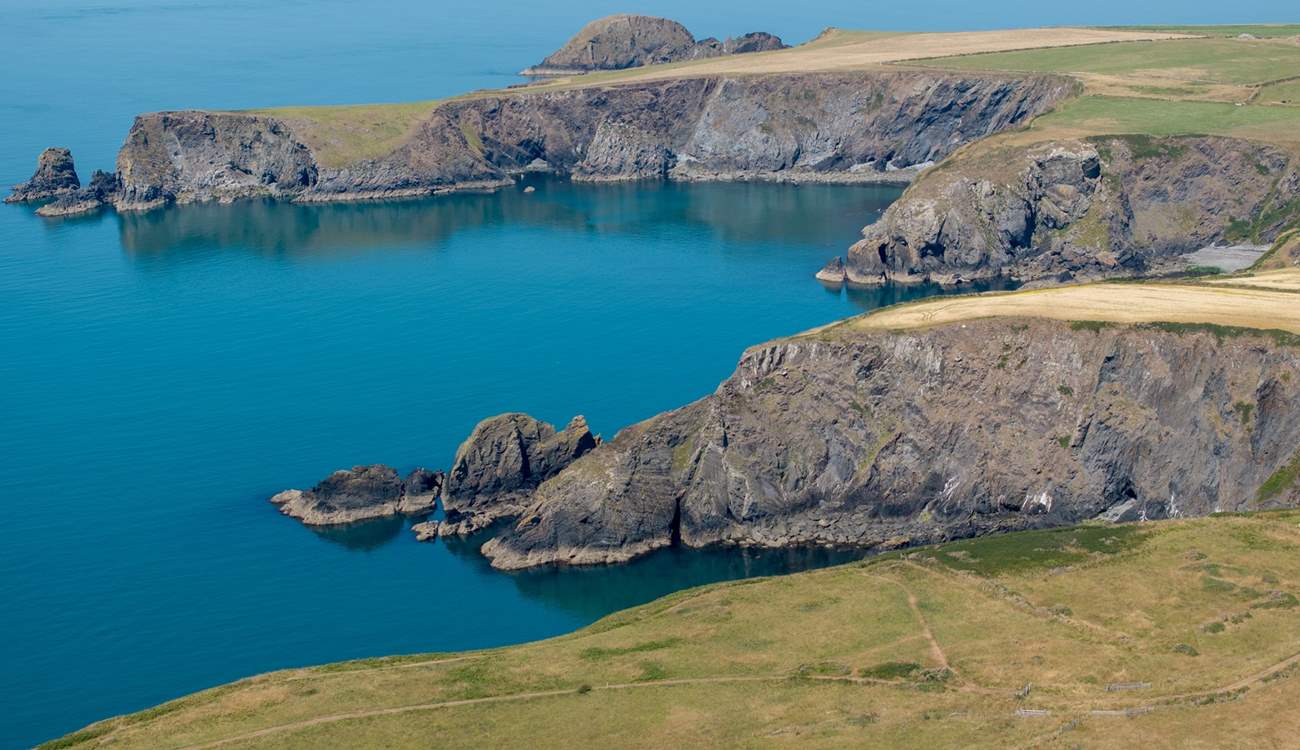 Explore the coastal path to discover craggy coves, golden sandy beaches and pretty seaside villages. 