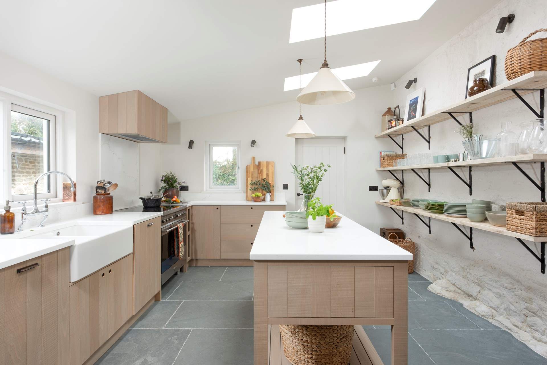 The bespoke kitchen is luxurious and refined.