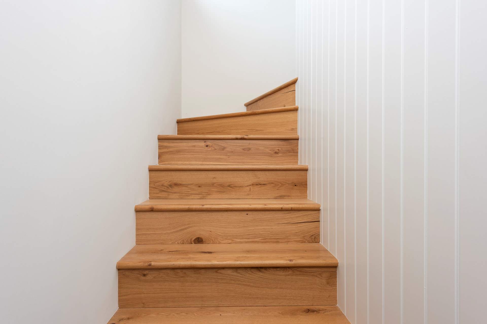 The bespoke oak staircase leading to the first floor.