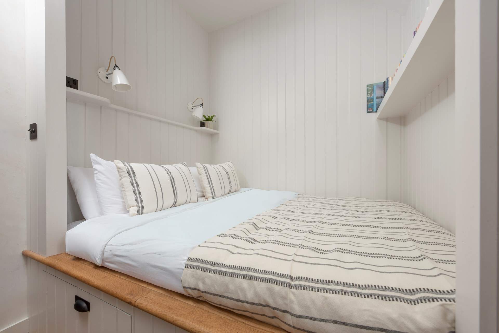 Bedroom 2 has a double bed in this innovative alcove, a true hideaway.