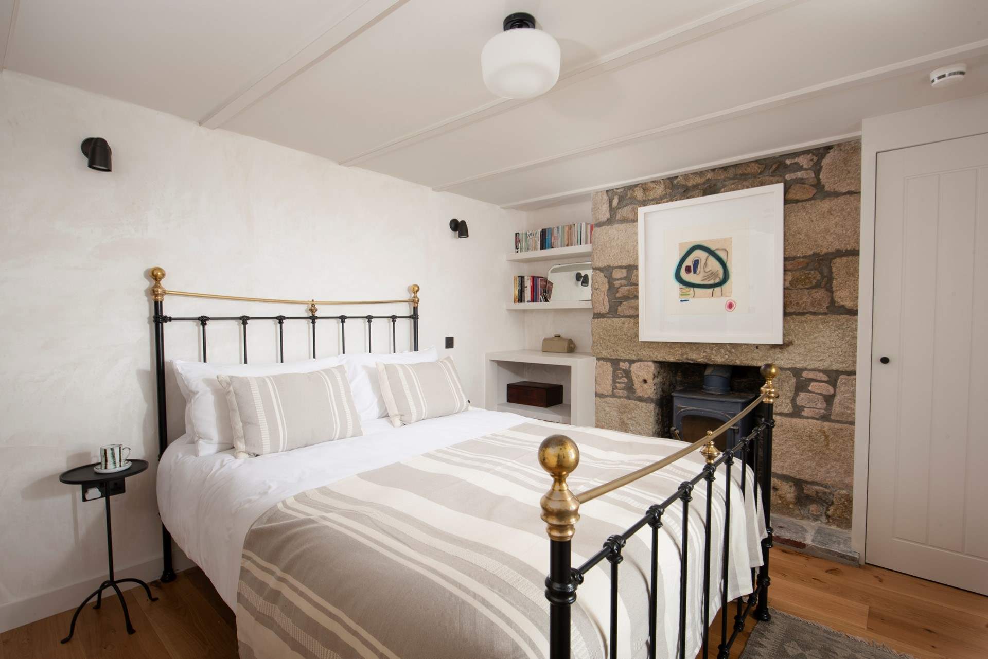 Soft linens and textured stone create a serene space to relax.