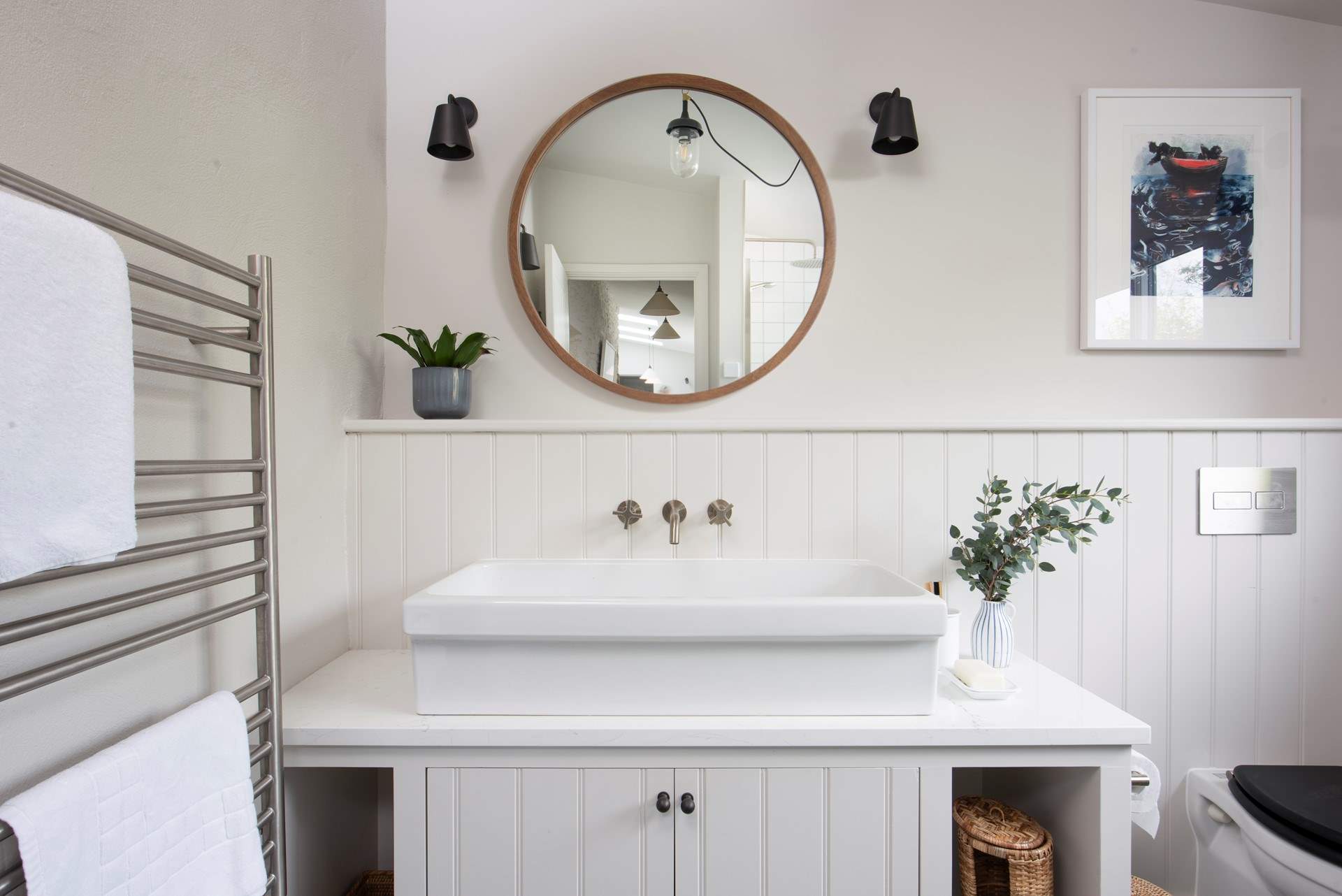 ...complete with heated towel rail and a large basin.